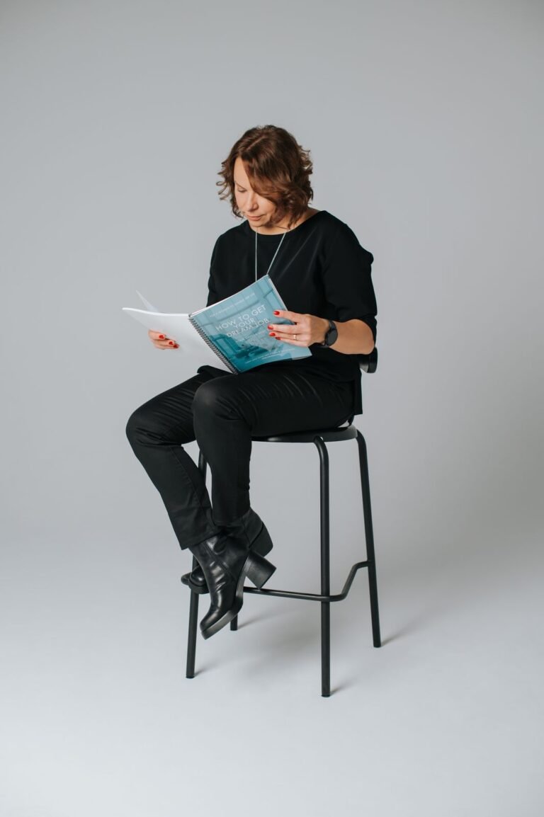 Vervidus founder reading a printed report on a stool